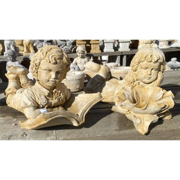 Boy Laying with Book and Girl Laying with Flower Medium Concrete Statue Pair